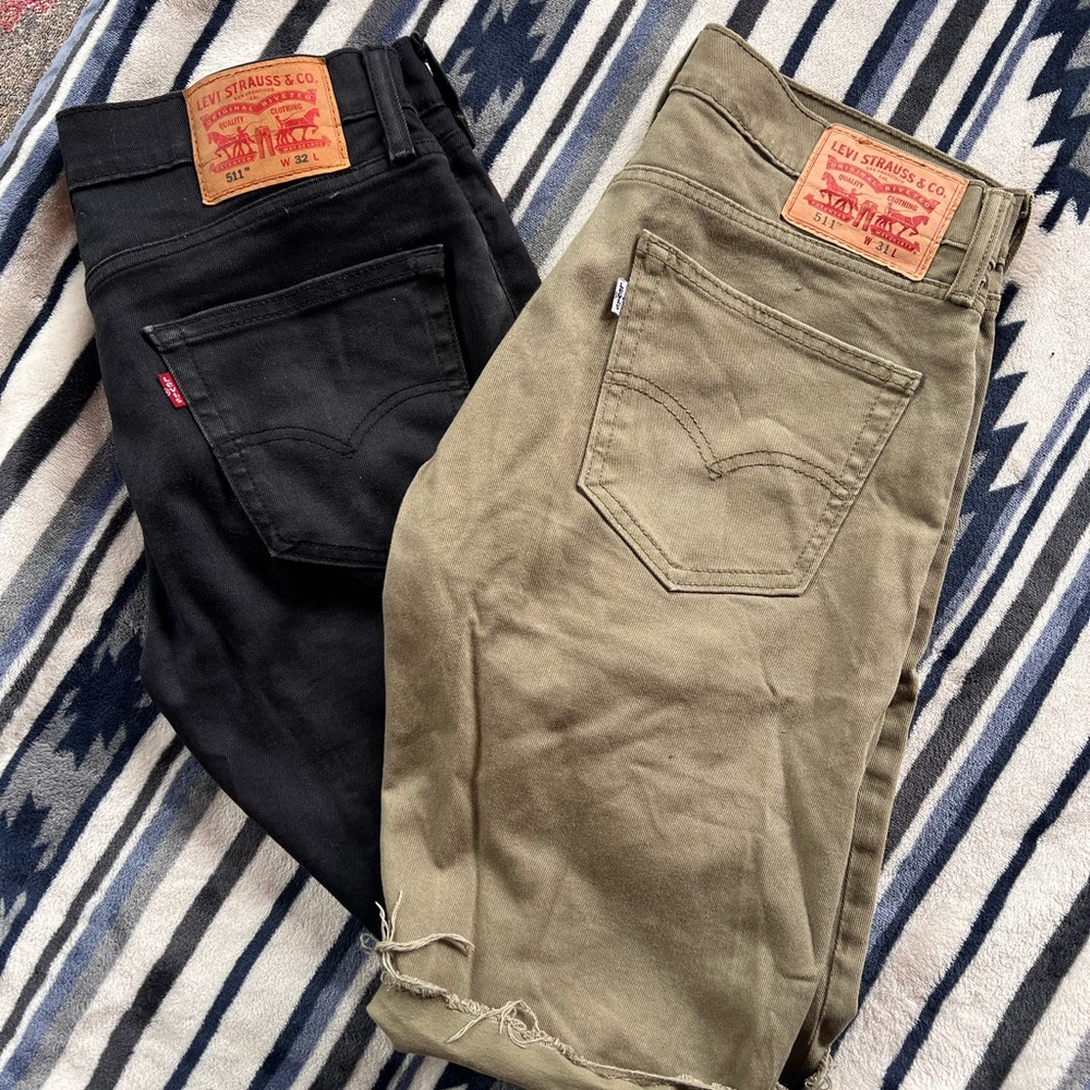 Two pair of Levi’s 511 slim shorts, one black and one green.
